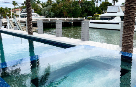 custom pool with hot tub, new dock, and seawall reno